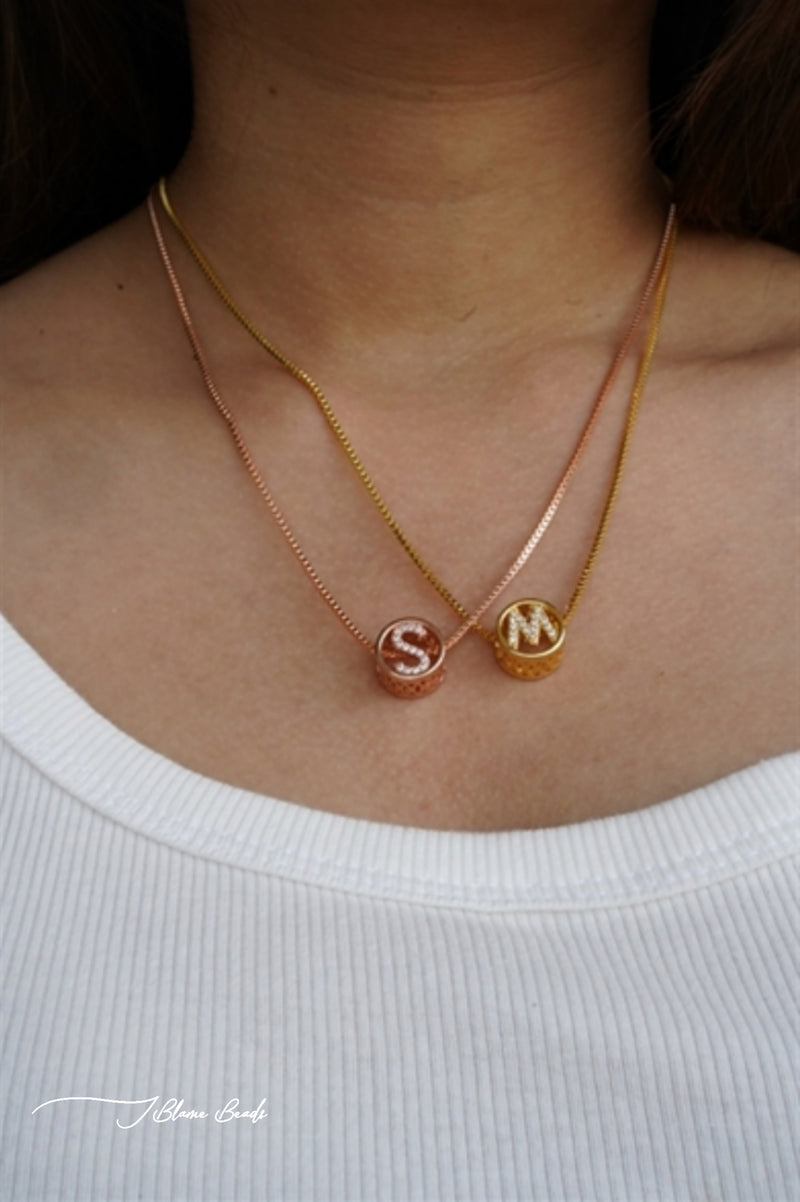 Circular studded initial necklace
